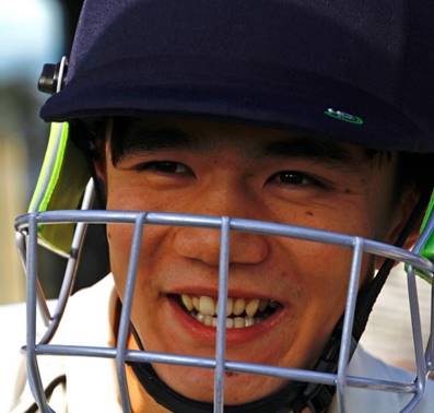 A close-up of a person wearing a helmet

Description automatically generated