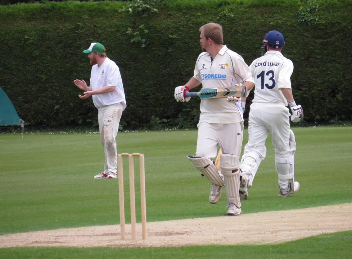 A group of men playing cricket

Description automatically generated with medium confidence