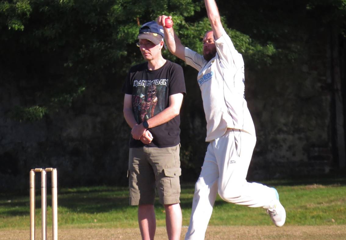 A person throwing a ball to another person

Description automatically generated with medium confidence
