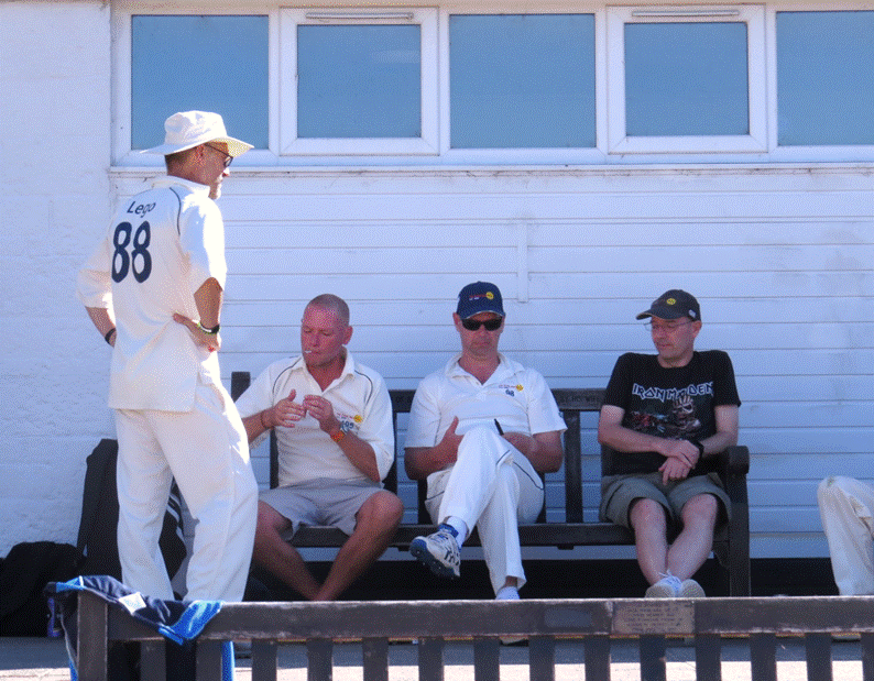 A group of men sitting on a bench

Description automatically generated with medium confidence