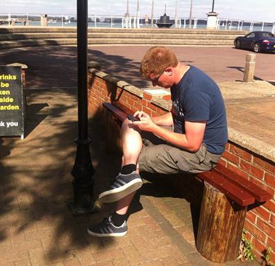 A person sitting on a bench

Description automatically generated with medium confidence